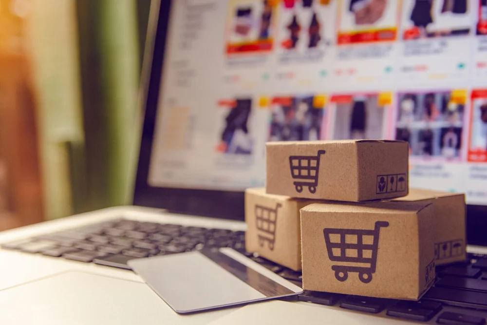 Shipping boxes beside an online storefront