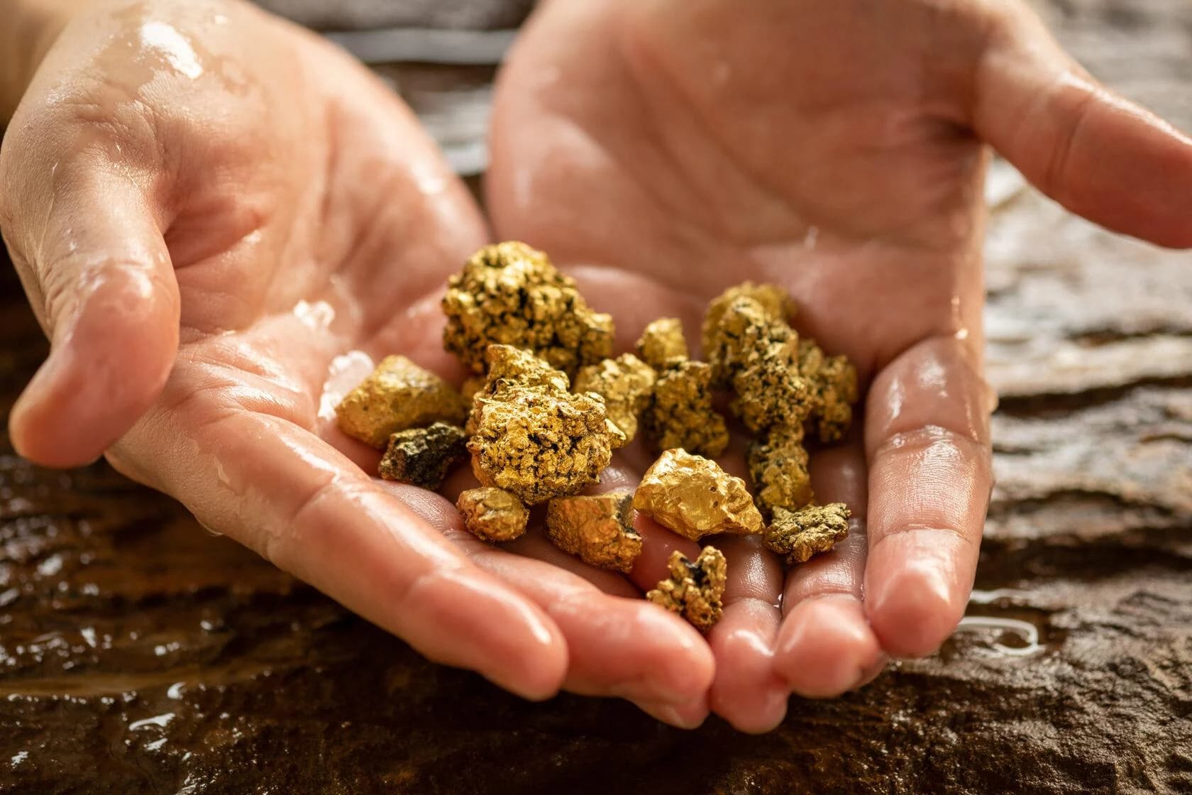 Hands holding gold pieces, illustrating milestones and value creation